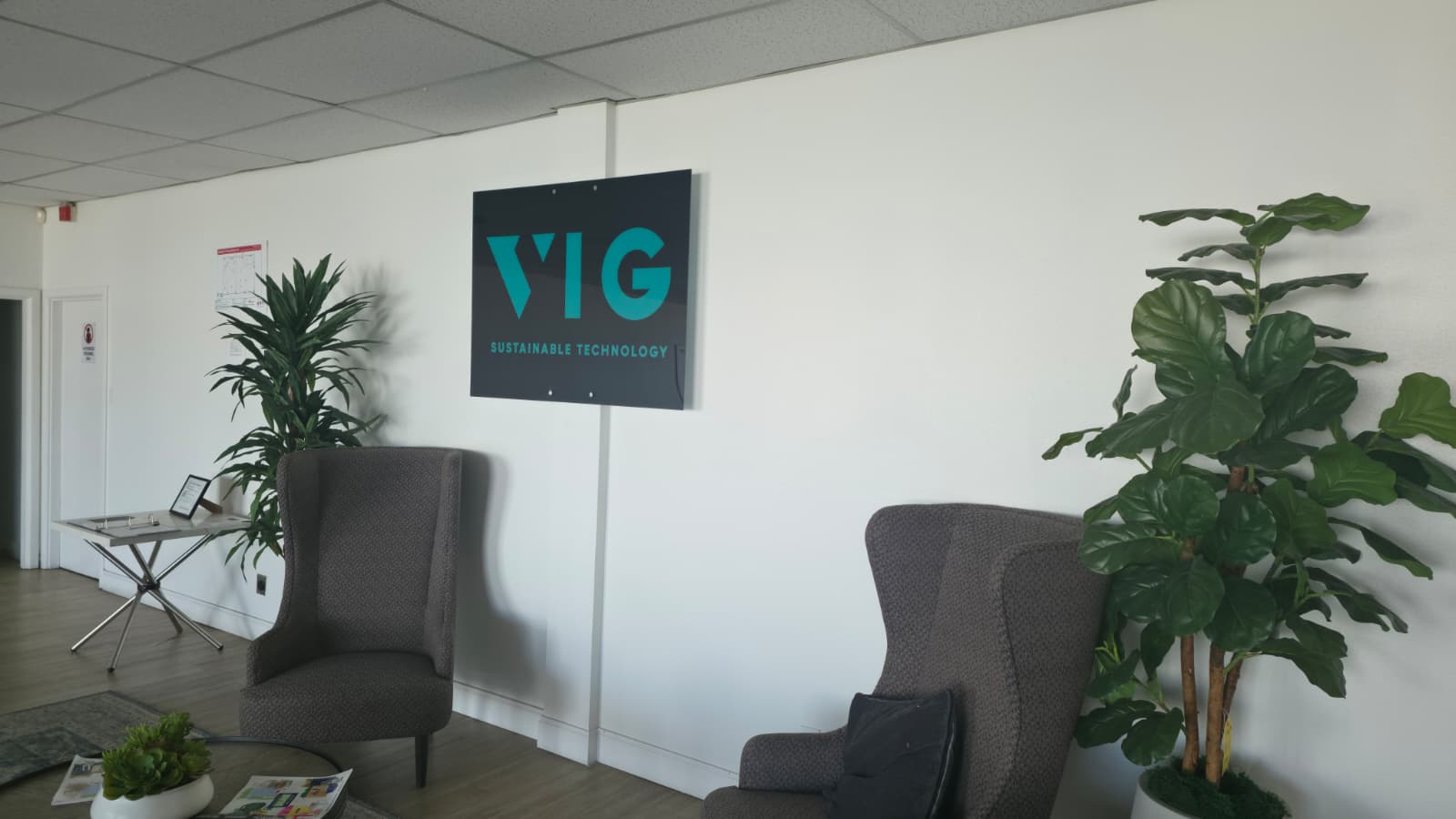 The VIG reception area with the Sustainable Technology sign in the Dallas office